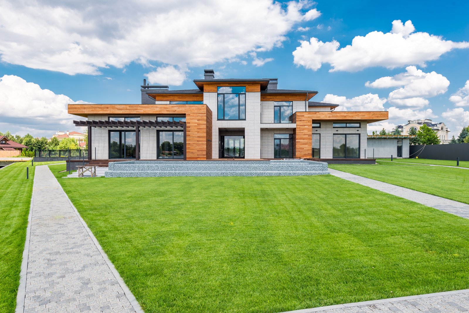 Architectural home with timber siding and expansive windows